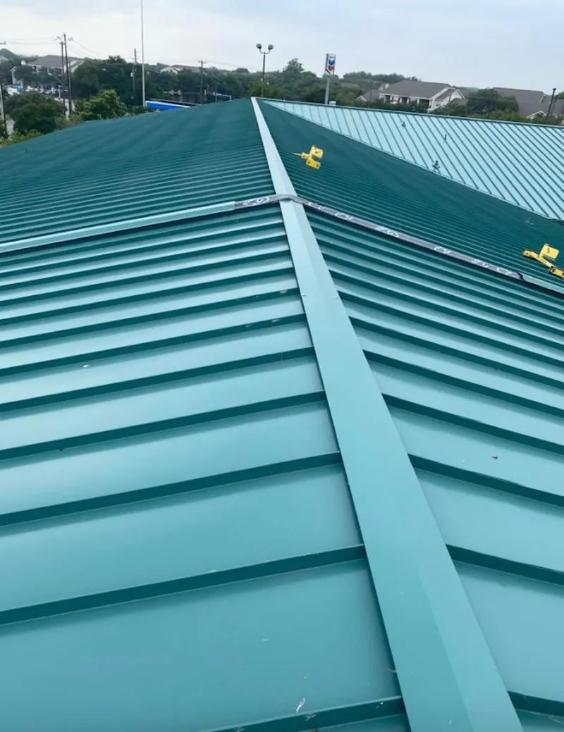 Green commercial metal roof ridge and valley for Metal Roof Repair in Batavia